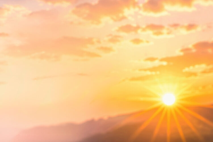 sunrise over mountains with clouds